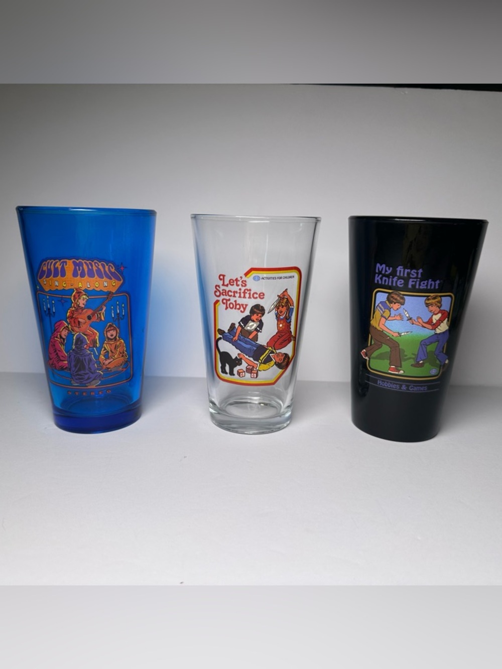 Set Of 3-PINT GLASSES-Satirical Retro Dark Humor Sinister 70’s Nostalgia-Rhodes